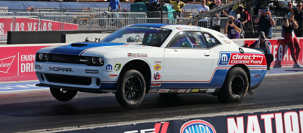 Image of a super stock car, with mopar direct connection branding